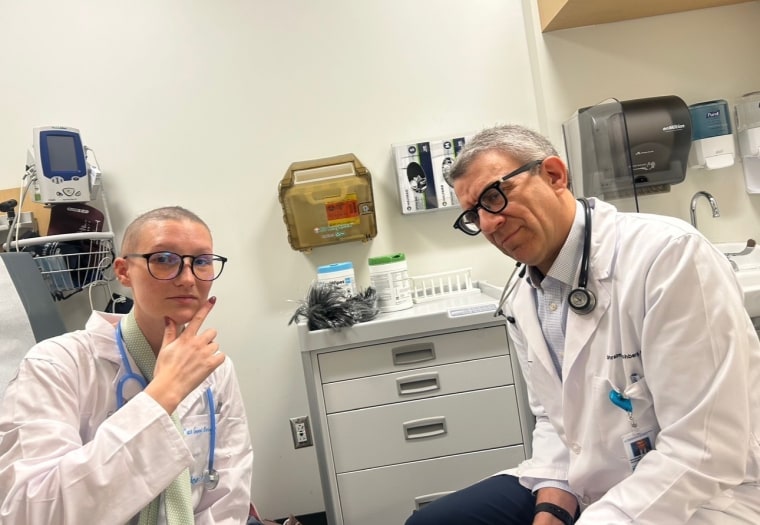 Holmes dressed as her oncologist, Dr. Effi Hochberg, for Halloween.