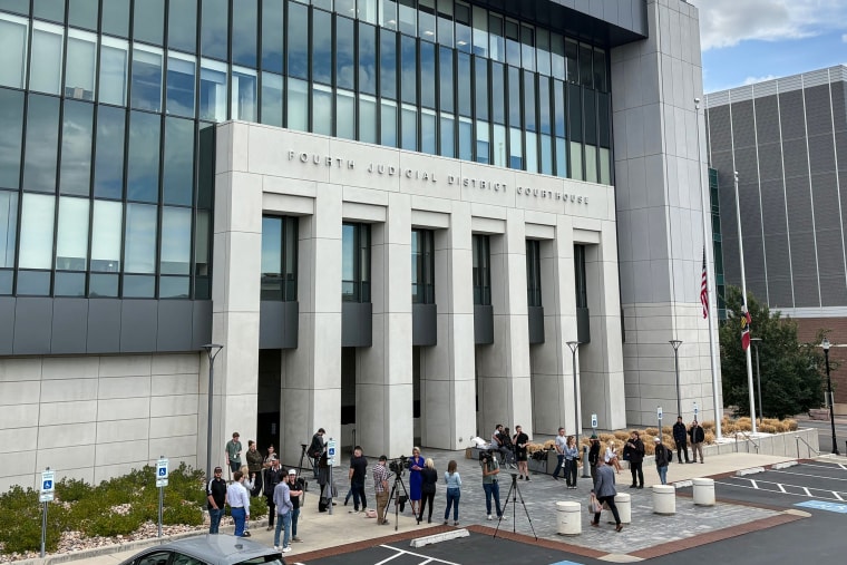 people gather outside the Fourth Judicial District Courthouse in Provo, Utah.