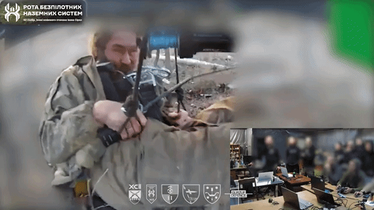 Image: A moving gif shows an injured soldier lifted from the ground via a drone.