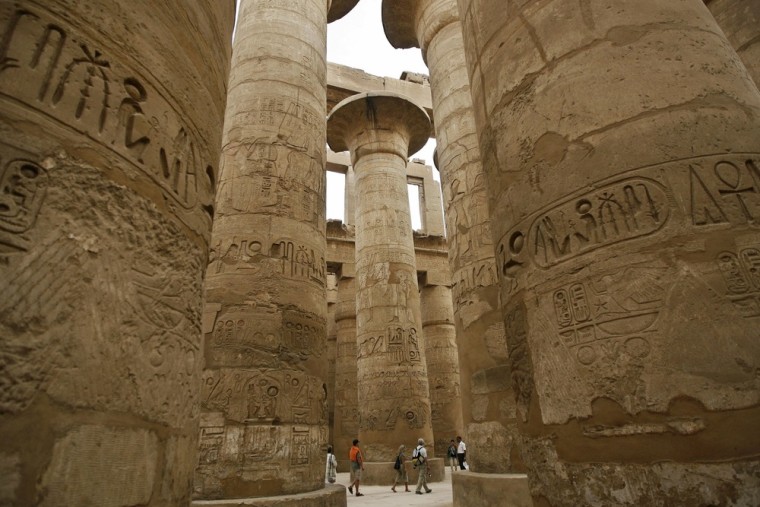 Stone columns decorated with hieroglyphs are one of the many draws at the Karnak temple complex in Luxor, Egypt.