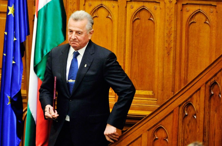 Hungarian President Pal Schmitt (left) announces his resignation in parliament in Budapest, Hungary, Monday.