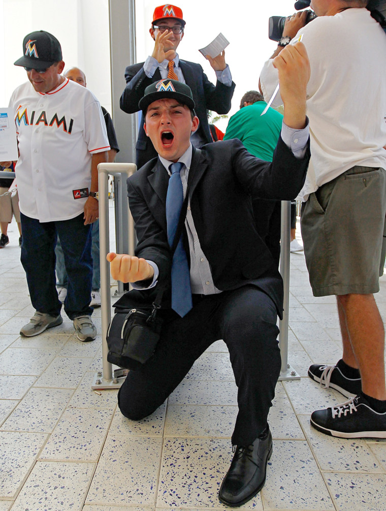 A fan celebrates as he enters the stadium for Opening Day between the Miami Marlins and the St. Louis Cardinals at Marlins Park on April 4, 2012 in Miami, Florida.