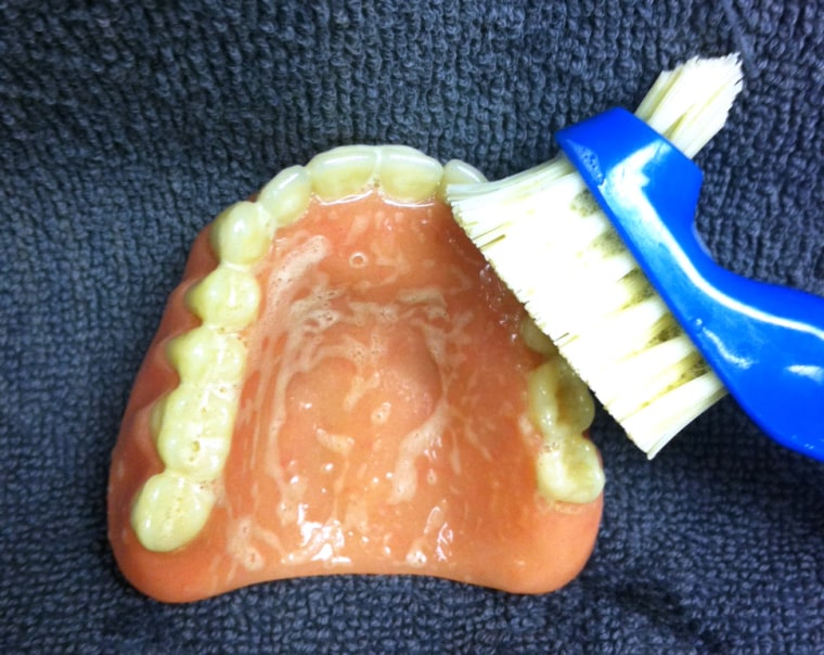 Denture experts say a daily scrub with a stiff brush is vital to removing potentially dangerous biofilms from false teeth. New research also shows that microwaving or soaking in a germicide rinse can disinfect dentures for up to a week.