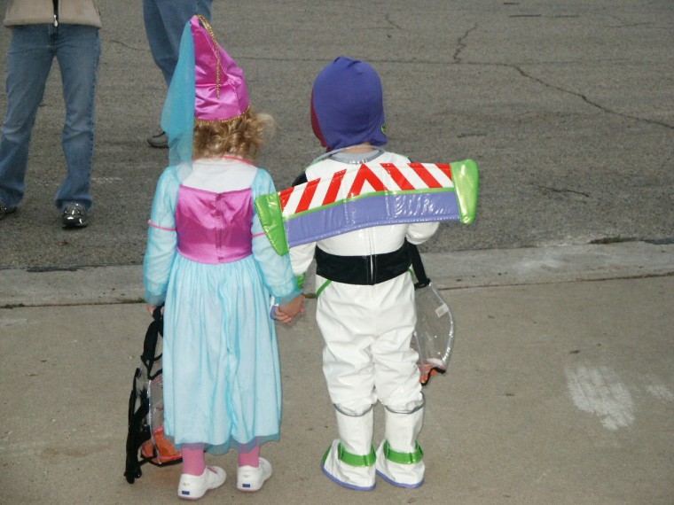 Reiley, 3, (right) knows Buzz Lightyear is ''Just a TOY!'' but he always made sure his princess was very safely escorted across the street.