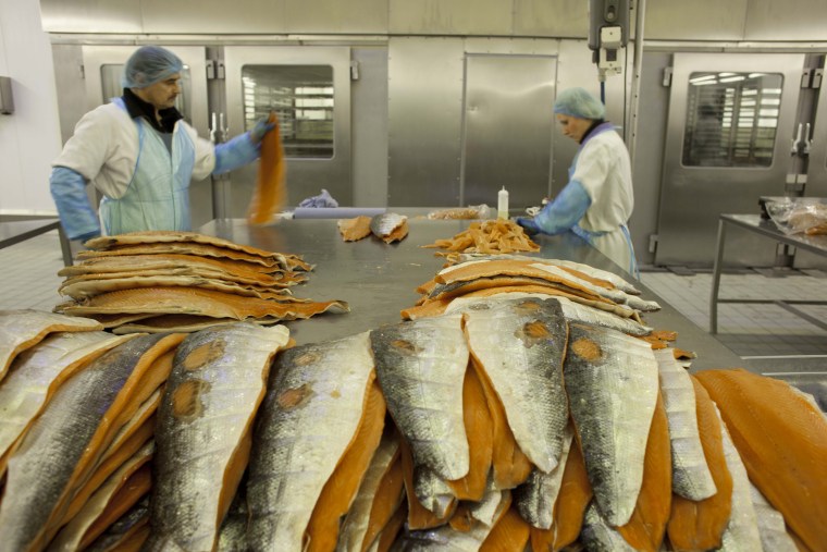 Salmon is sliced and processed at H. Forman and Son, a fourth-generation family business, at its new location directly across the River Lea from the Olympic Stadium.