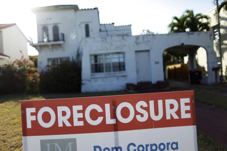 A foreclosure sale sign sits in front of a house in Miami Beach, Florida in this file photo.