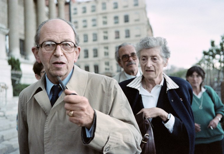 A file photo taken in 1987 showing French Resistance leader Raymond Aubrac (L) and his now-deceased wife Lucie (R) leaving the couthouse during the trial of former Lyon Gestapo chief Klaus Barbie for crimes against humanity.
