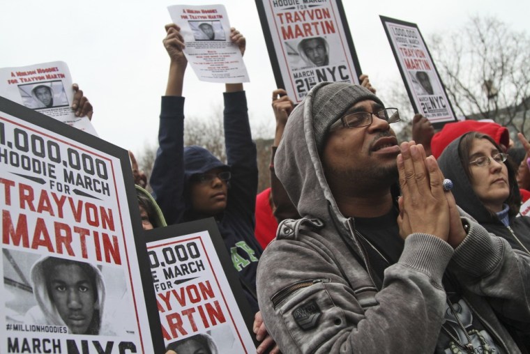 Demonstrators pray during the Million Hoodie March in Union Square Wednesday, March 21, 2012 in New York. The march was in memory of Trayvon Martin, an unarmed teen shot and killed in Florida in February.