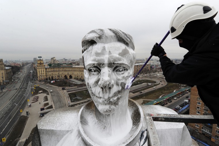 A municipal worker washes the upper part of the to 70-meter high monument to Yuri Gagarin, the first man in space, at the Gagarin Square in Moscow, on April 11. Russia celebrated today Aviation and Cosmonautics Day, the anniversary of Yuri Gagarin making the first manned space flight in 1961.