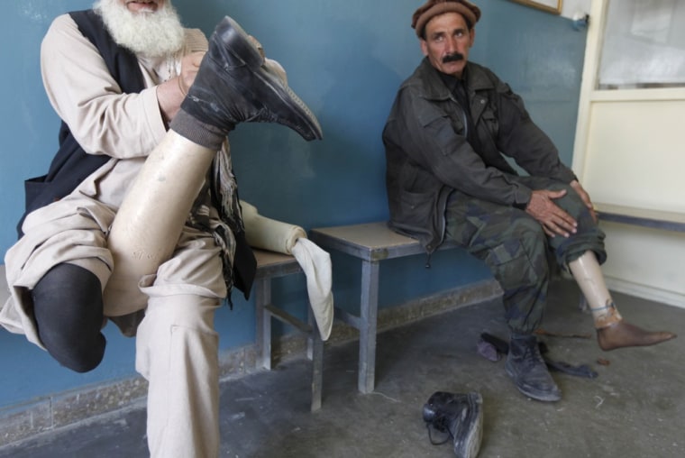 Afghan amputees wait for treatment at an ICRC hospital for war victims at the Orthopedic Center of the International Committee of the Red Cross in Kabul.