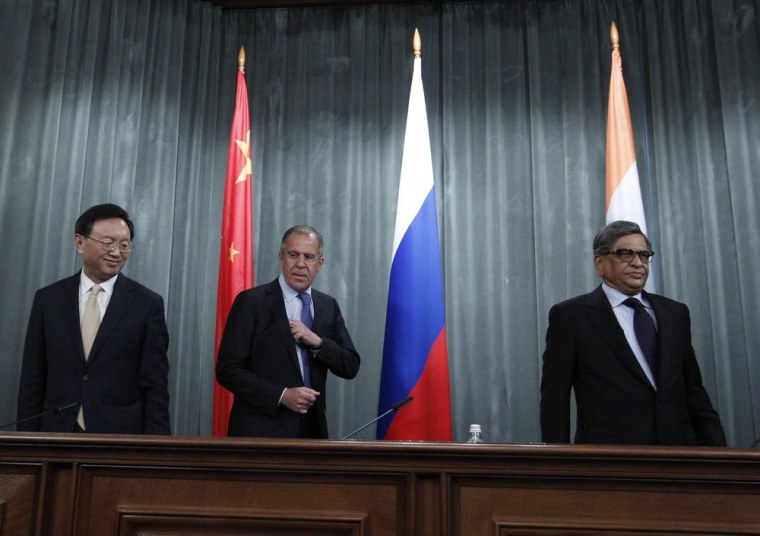 Russia's Foreign Minister Sergei Lavrov, center, arrives with Chinese counterpart Yang Jiechi, left, and Indian counterpart Somanahalli Mallaiah Krishna for a joint news conference in Moscow on April 13, 2012.