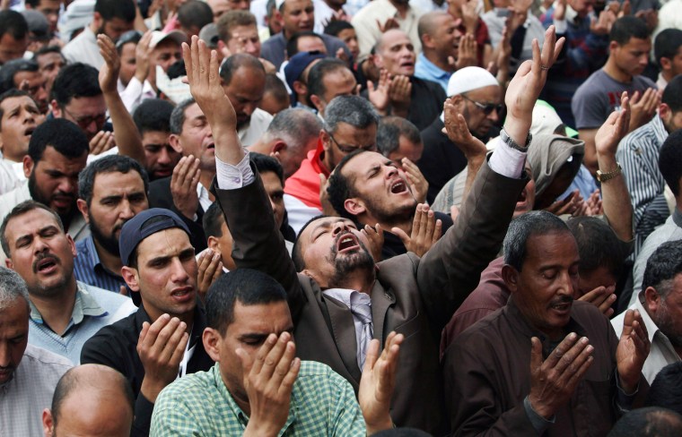 People attend Friday prayers in Tahrir square in Cairo on April 13. Thousands of Egyptians packed into Cairo's Tahrir Square on Friday to protest against a run for the presidency by former intelligence chief Omar Suleiman, in an Islamist show of strength against Hosni Mubarak's old guard.