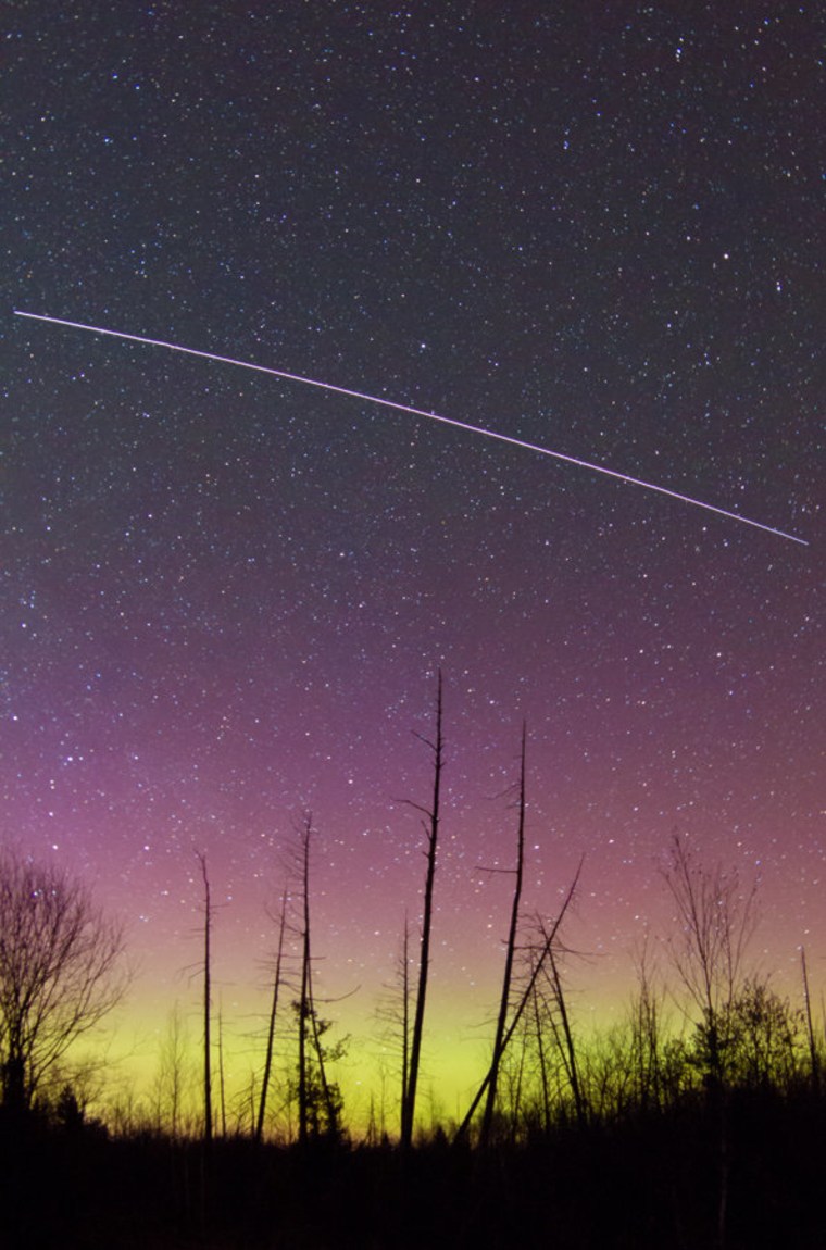 Here's a different angle on the aurora and the International Space Station, captured by Brian Larmay of Beecher, Wis. The long streak in this time-lapse photograph is the space station, sailing across the sky. To see more of Larmay's pictures, check out his SmugMug gallery.