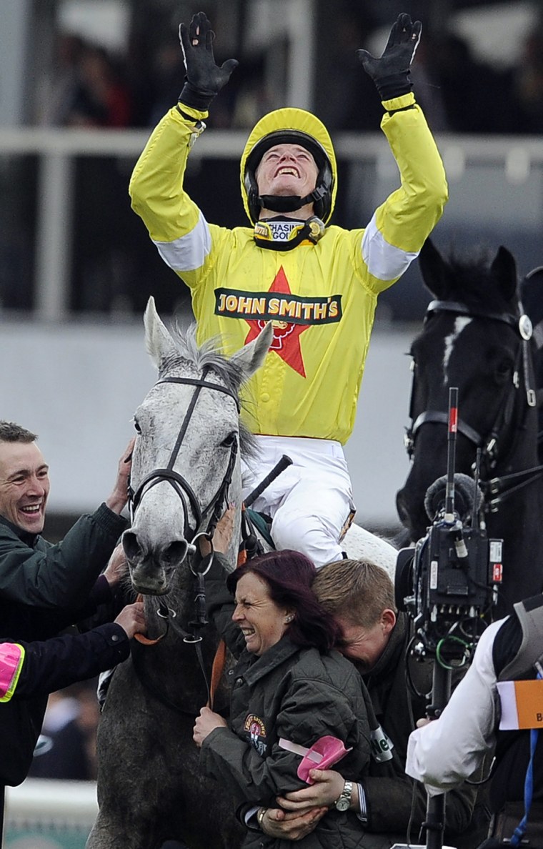 Daryl Jacob celebrates winning the Grand National Steeple Chase aboard Neptune Collonges.