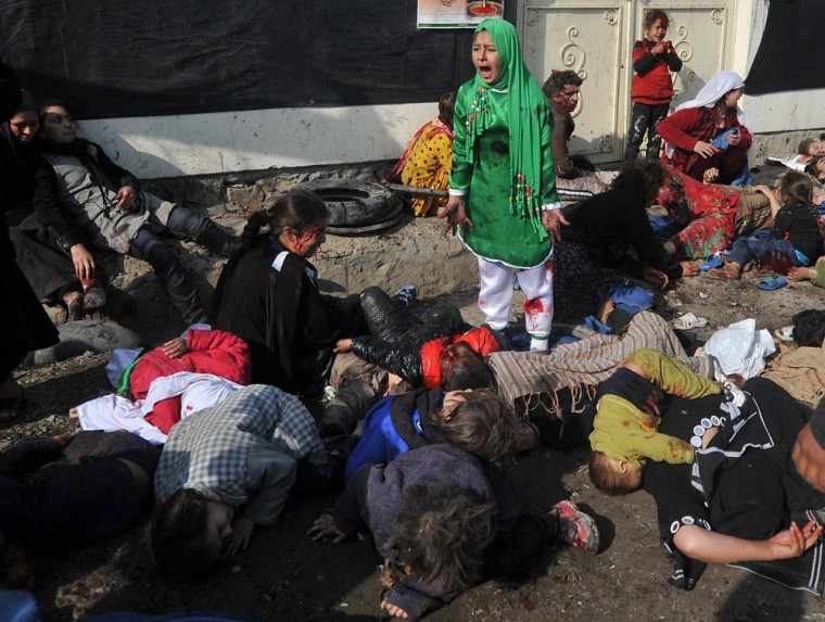 This photo dated December 6, 2011 shows Afghan Shia Muslim 12-year-old Tarana Akbari crying near dead and injured people after explosions during a religious ceremony at the Abul Fazel shrine in the centre of Kabul where Shia Muslims were marking the Day of Ashura. Agence France-Presse photographer Massoud Hossaini won the agency's first Pulitzer Prize for the picture on April 16 in the breaking news photography category.