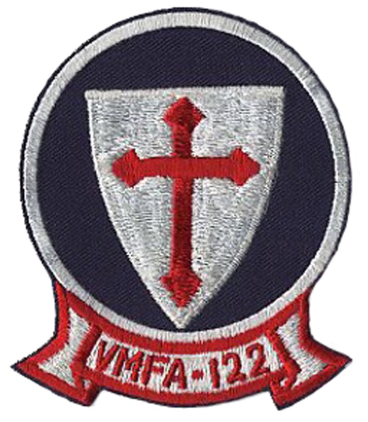 The insignia for the VMFA-122