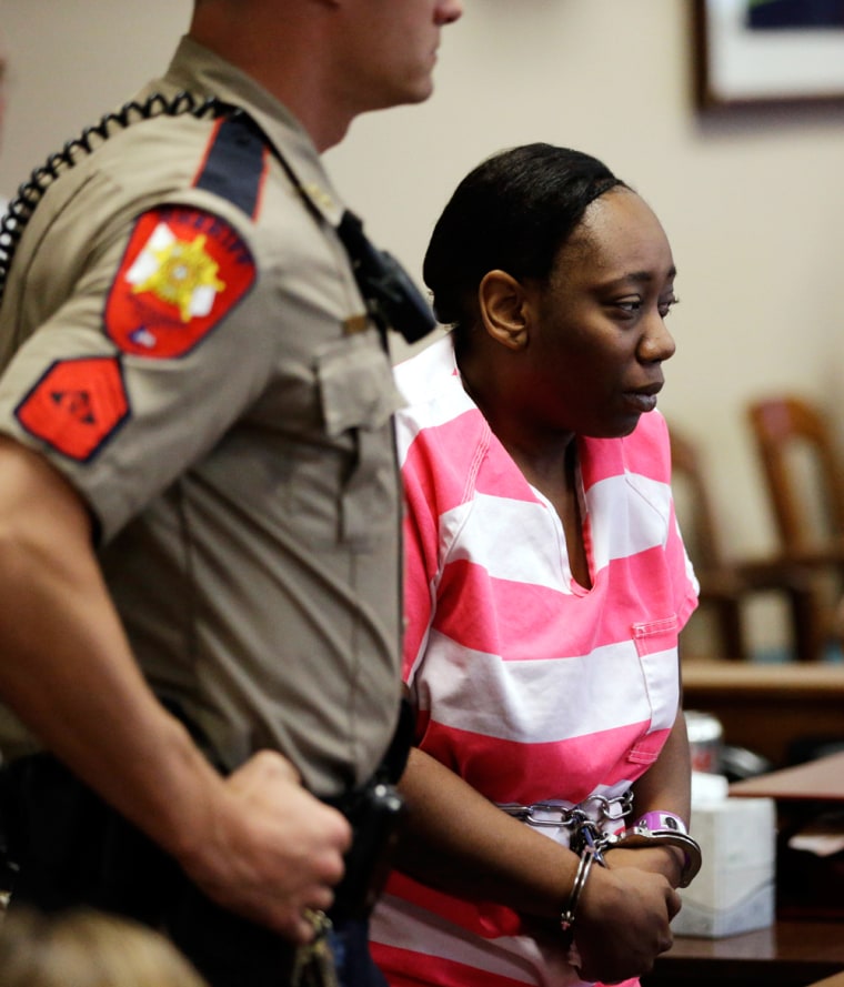 Verna McClain is escorted into the courtroom for a hearing Thursday in Conroe, Texas.