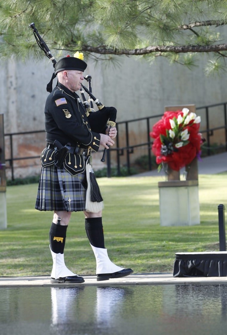 Bagpiper Kevin M. Donnelly marches past the Field of Chairs during the ceremony at the Oklahoma City National Memorial & Museum on April 19.