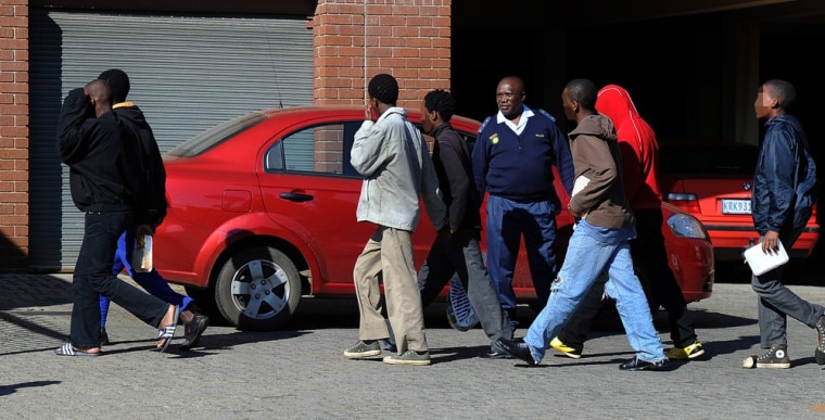 The seven suspects accused of gang raping a 17-year-old Soweto girl appear at the Roodepoort Regional Court, on April 19, 2012. EDITOR'S NOTE: The identity of the suspects has been digitally altered before msnbc.com received the image.