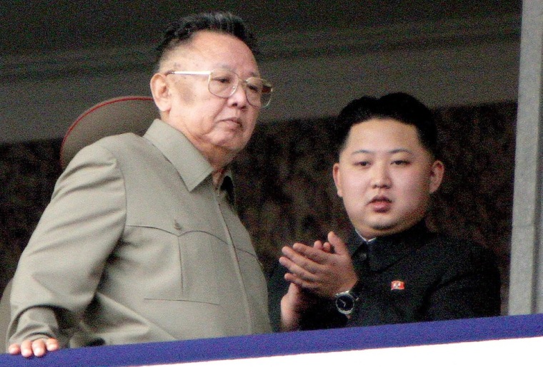 North Korean leader Kim Jong Il, left, and his son Kim Jong Un watch from a podium during a parade celebrating the 65th anniversary of the ruling Korean Workers Party in Pyongyang on Oct. 10, 2010. The elder Kim died on Dec. 17, handing power over to his son.