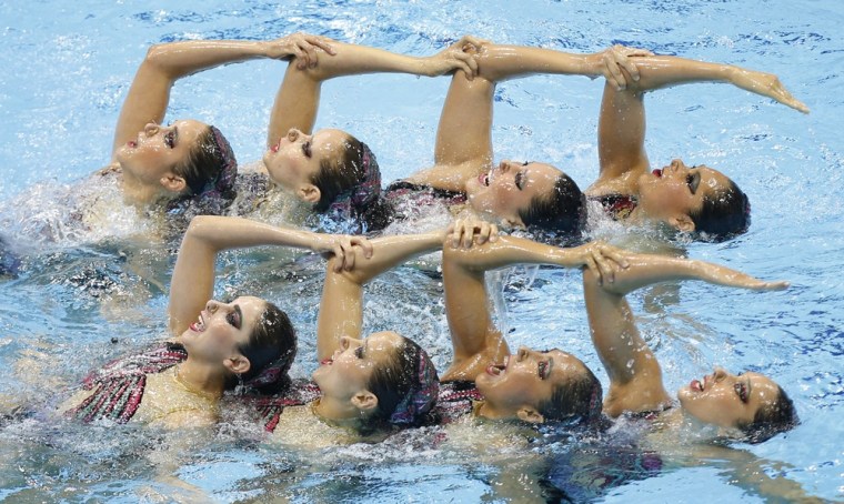 Competitors from Mexico perform during the team technical routine at the synchronized swimming Olympic qualification event at the Aquatic Centre in the London on April 19.