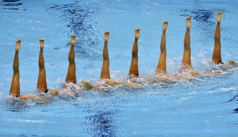 Japan performs during the team technical routine at a synchronized swimming qualification event on April 19 at the Aquatic Centre at Olympic Park in London.