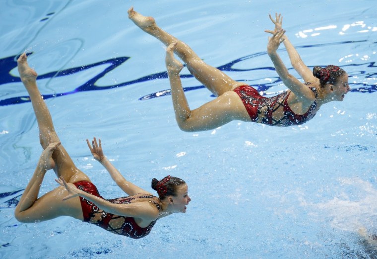 Competitors from Russia perform April 19 during the team technical routine at the synchronized swimming Olympic qualification event at the Aquatic Centre in the Olympic Park in London.