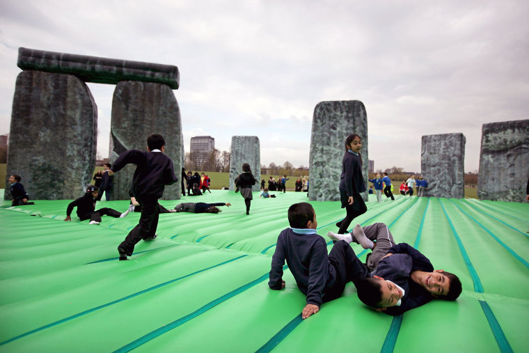Children play on an interactive piece of artwork by Jeremy Deller is launched as part of the Glasgow International Festival of Visual Arts at Glasgow Green on April 20, in Glasgow, Scotland.