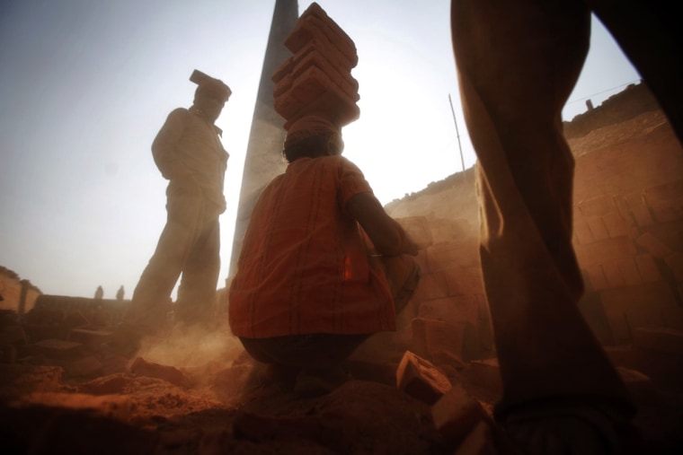 Nepalese men work at a brick factory in Imadol on the outskirts of Katmandu, Nepal on April 20.
