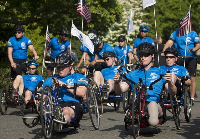 Cyclists with the sixth annual Wounded Warrior Project's Soldier Ride wait to ride around the South Lawn of the White House in Washington D.C. on April 20.