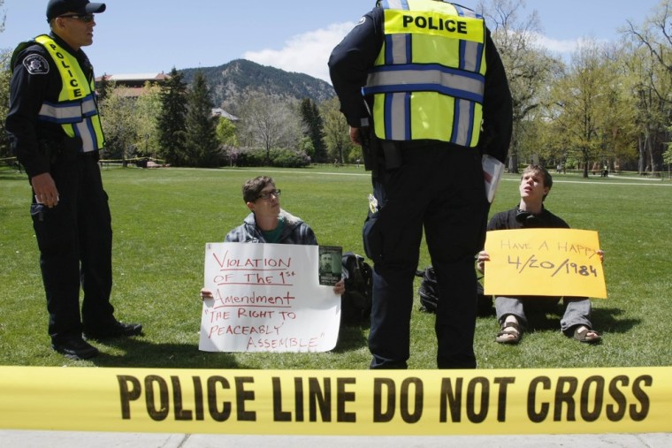 Police prepare to arrest Colorado University students for trespassing on the campus in Boulder, Colo. on April 20.