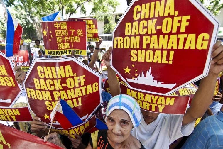 Filipino protesters demanding that China pull out of the contested Scarborough Shoal in the South China Sea demonstrate Friday outside the Chinese Embassy in Makati City in Manila, Philippines.