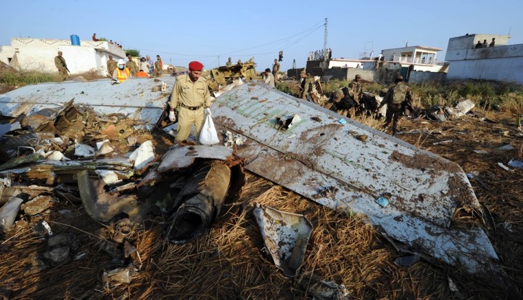 Pakistani soldiers and rescue workers search through debris in Hussain Abad after a Bhoja Air Boeing 737 plane crashed on the outskirts of Islamabad on April 21, 2012. Pakistan has launched an investigation after the passenger jet crashed while attempting to land during a thunderstorm, with all 127 people on board believed dead.