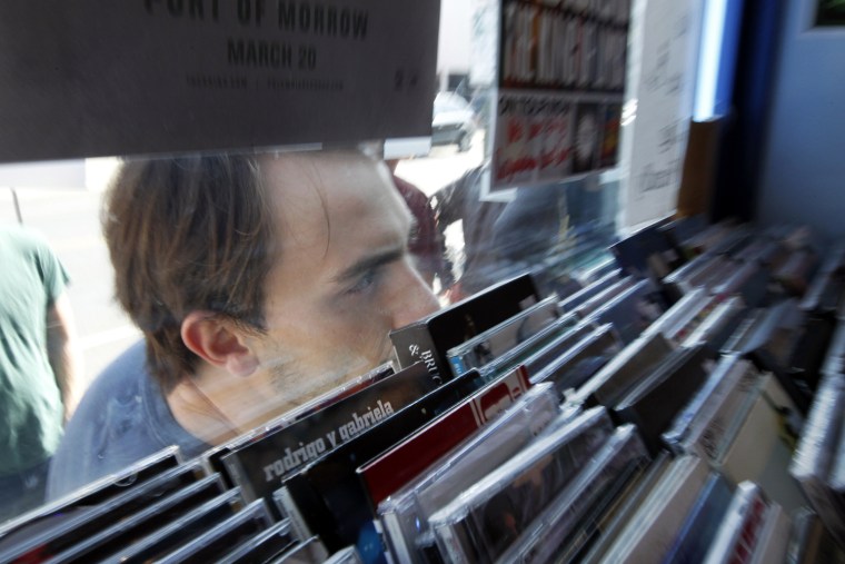 Mike Hughes, from Philadelphia, looks through the window as he waits in line on the fifth annual Record Store Day at Main Street Music in Philadelphia.