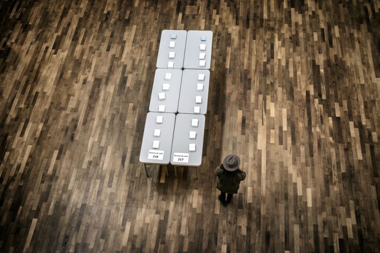 Ballots are displayed on a table in a polling station in Lyon during first round voting.
