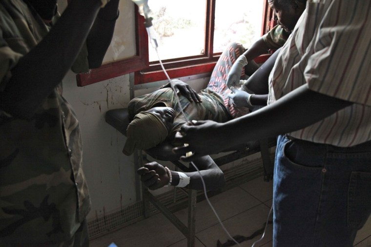 A South Sudanese soldier has a bullet removed from his leg in the Rubkona Military Hospital on April 22, 2012.