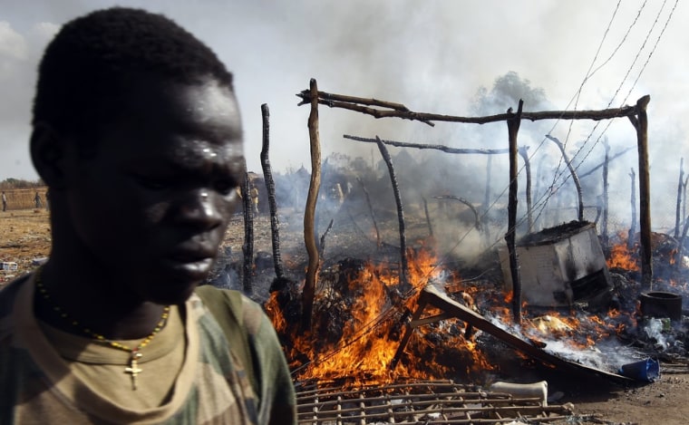A soldier in South Sudan's SPLA army walks in a market destroyed in an air strike by the Sudanese air force in Rubkona on April 23, 2012.