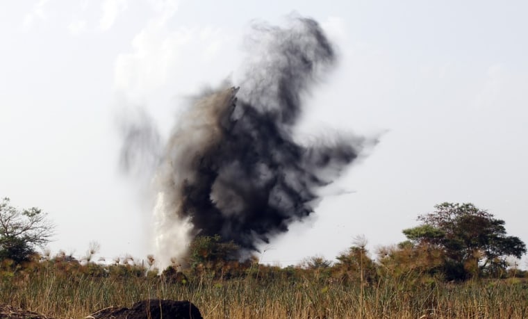 Smoke rises after the Sudanese air force fired a missile during an air strike in Rubkona on April 23, 2012.