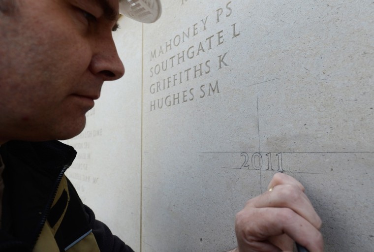 Stonemason Nick Hindle begins inscripting of the 59 names of the UK servicemen and women who were killed on duty or through terrorism in 2011 at the Armed Forces Memorial on April 23 in Alrewas, Staffordshire. The additional names will take 3 weeks to engrave and will be dedicated during a service for their families later this year.