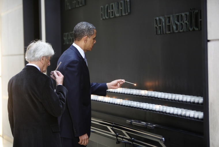 President Barack Obama and Elie Wiesel light candles in the Hall of Remembrance at the Holocaust Museum April 23, 2012 in Washington, DC.