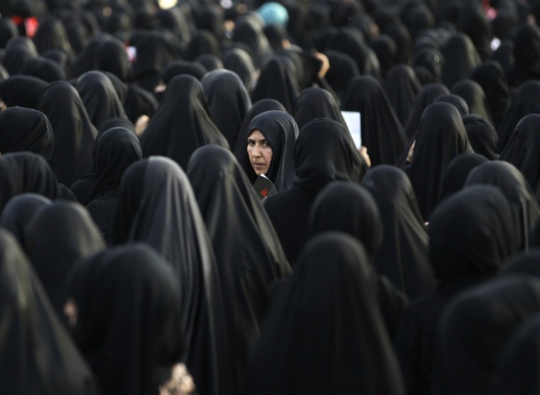 A female mourner looks back as she participates in the funeral procession of Salah Abbas Habib in the district of al-Bilad al-Qadeem in the capital Manama on April 23.