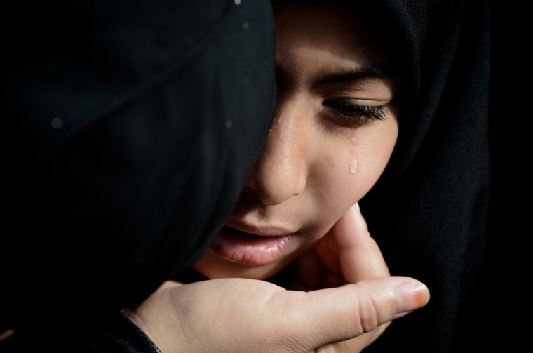 A Bahraini Shiite Muslim woman mourns during the funeral of Salah Abbas.