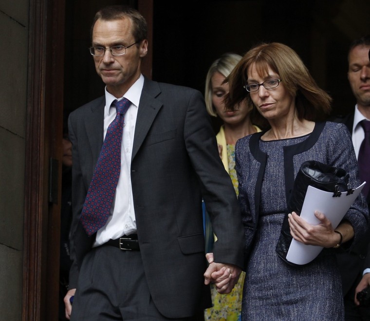 Ian and Ellen Williams and Cerri Subbe, the mother, father and sister of British MI6 agent Gareth Williams, leave Westminster Coroner's Court, in central London April 23, 2012.