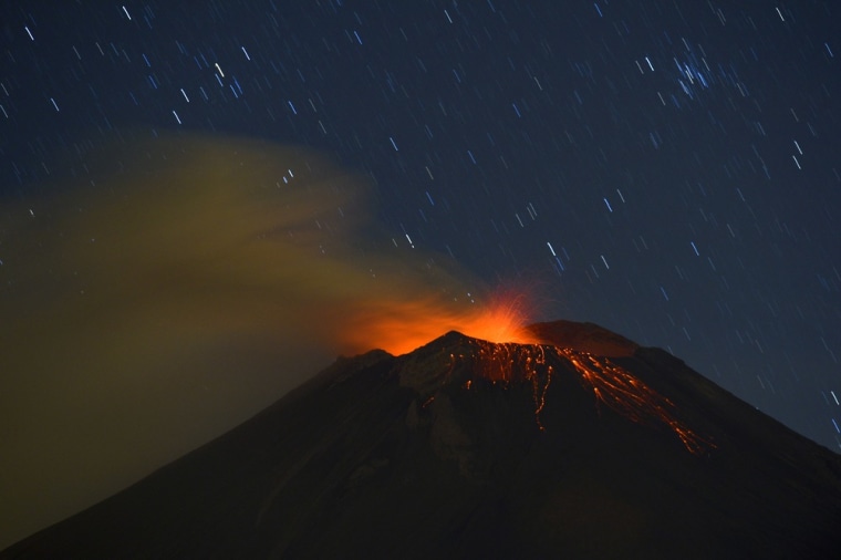 Incandescent materials, ash and smoke are spewed from the Popocatepetl Volcano, seen from Santiago Xalitzintla, in the Mexican central state of Puebla, on April 24. Residents at the foot of Mexico's Popocatepetl volcano no longer sleep soundly since the towering mountain roared back into action over a week ago, spewing out a hail of rocks, steam and ashes. The volcano, Mexico's second highest peak at 5,452 metres, started rumbling and spurting high clouds of ash and steam on April 13, provoking the authorities to raise the alert to level five on a seven-point scale.