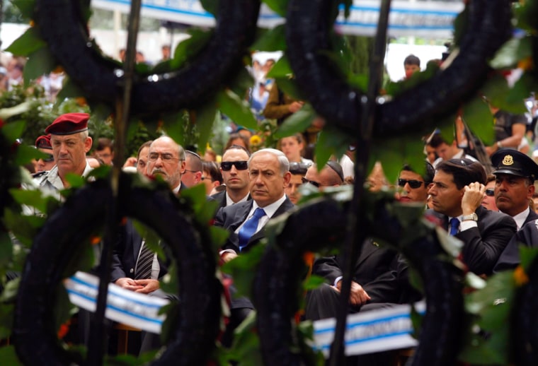 Israeli Prime Minister Benjamin Netanyahu, center, and military chief Lieutenant-General Benny Gantz attend a Memorial Day ceremony commemorating fallen soldiers at Mount Herzl military cemetery in Jerusalem on Wednesday.