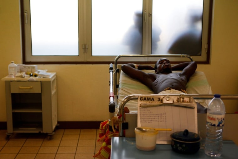 A man waits for medical treatment at Simao Mendes Hospital..