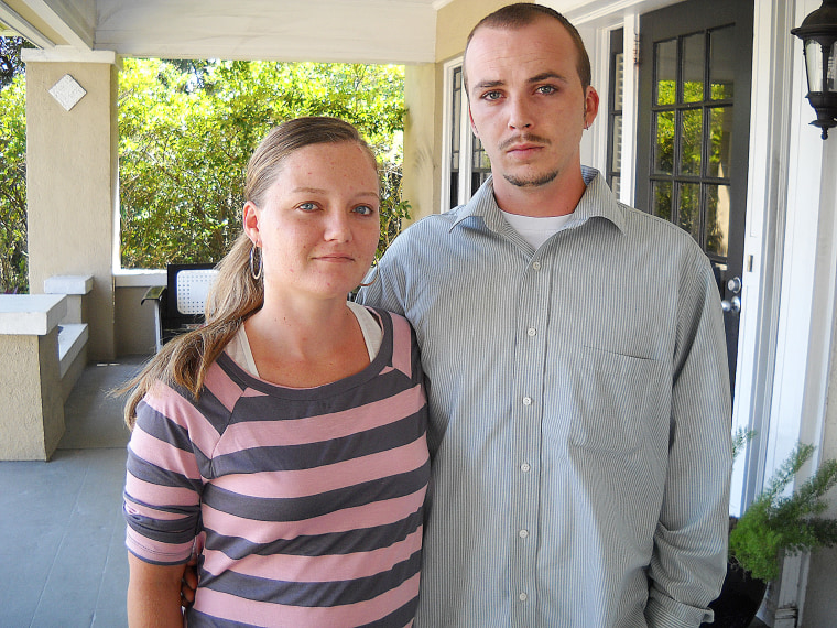 Robert Barnhart, right, and his wife, Kimberly. Barnhart claims he was fired by Lamar Advertising in August 2011 when he refused to continue poisoning trees that blocked the view of Lamar billboards. He has been granted immunity in a criminal investigation, and has sued over loss of his job.