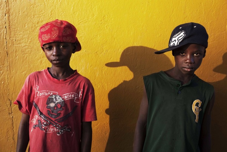 Komba Nyanku, left, 12, who wants to become a lawyer, and his friend, Abdoulaye Marrah, 12, who dreams of being a pilot, pose for a portrait in the town of Koidu on April 21, 2012. Neither of the boys has the money to pay school fees.