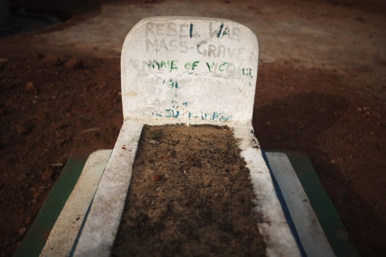 A headstone marks a mass grave of rebel victims in the village of Bomaru, where the conflict started in 1991, on April 22, 2012.