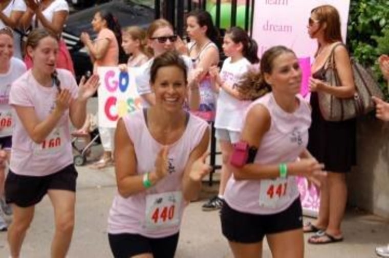 Jenna Wolfe grins at the camera as she races in a 2011 Girls on the Run 5K, an event that pairs adult